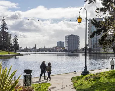 People walking beside Lake Merritt