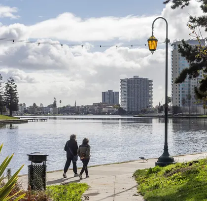 People walking beside Lake Merritt